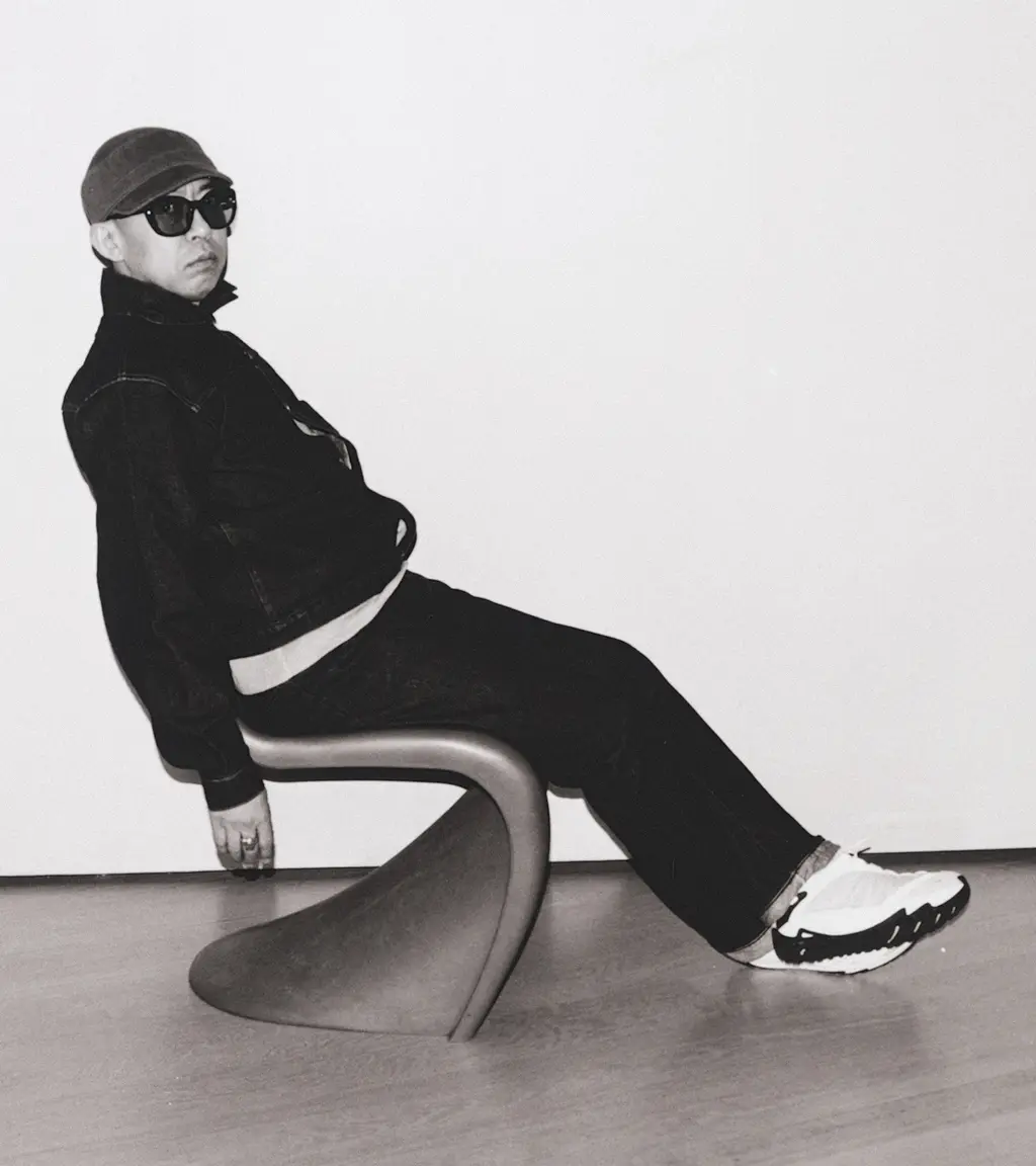 NIGO seated for the Design Museum retrospective