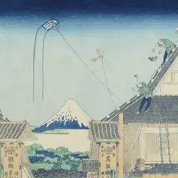 Hokusai woodblock of people on tiled roofs flying a kite, with Mount Fuji beyond